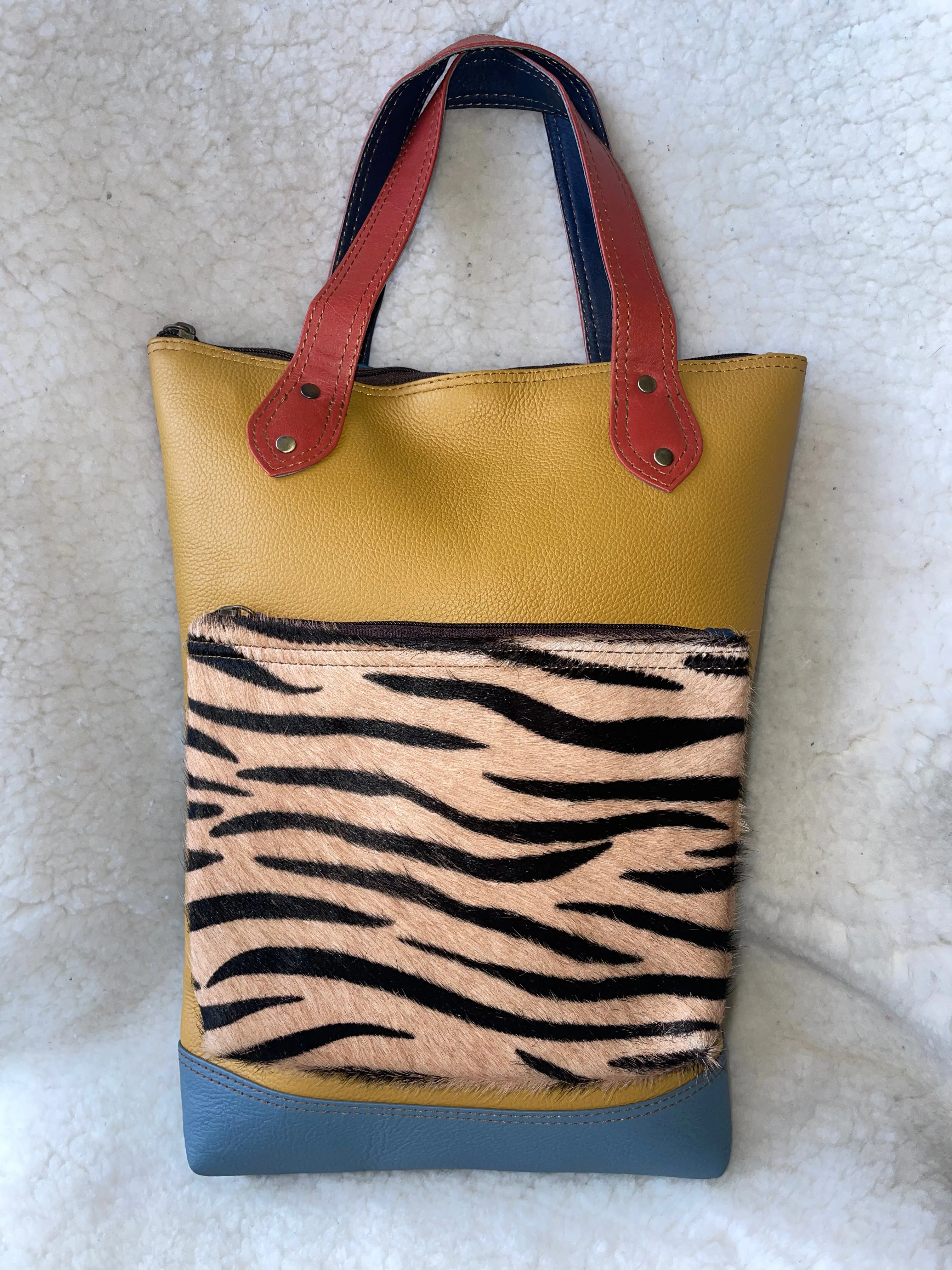 Handcrafted, Recycled Leather Backpack with Detachable Clutch.