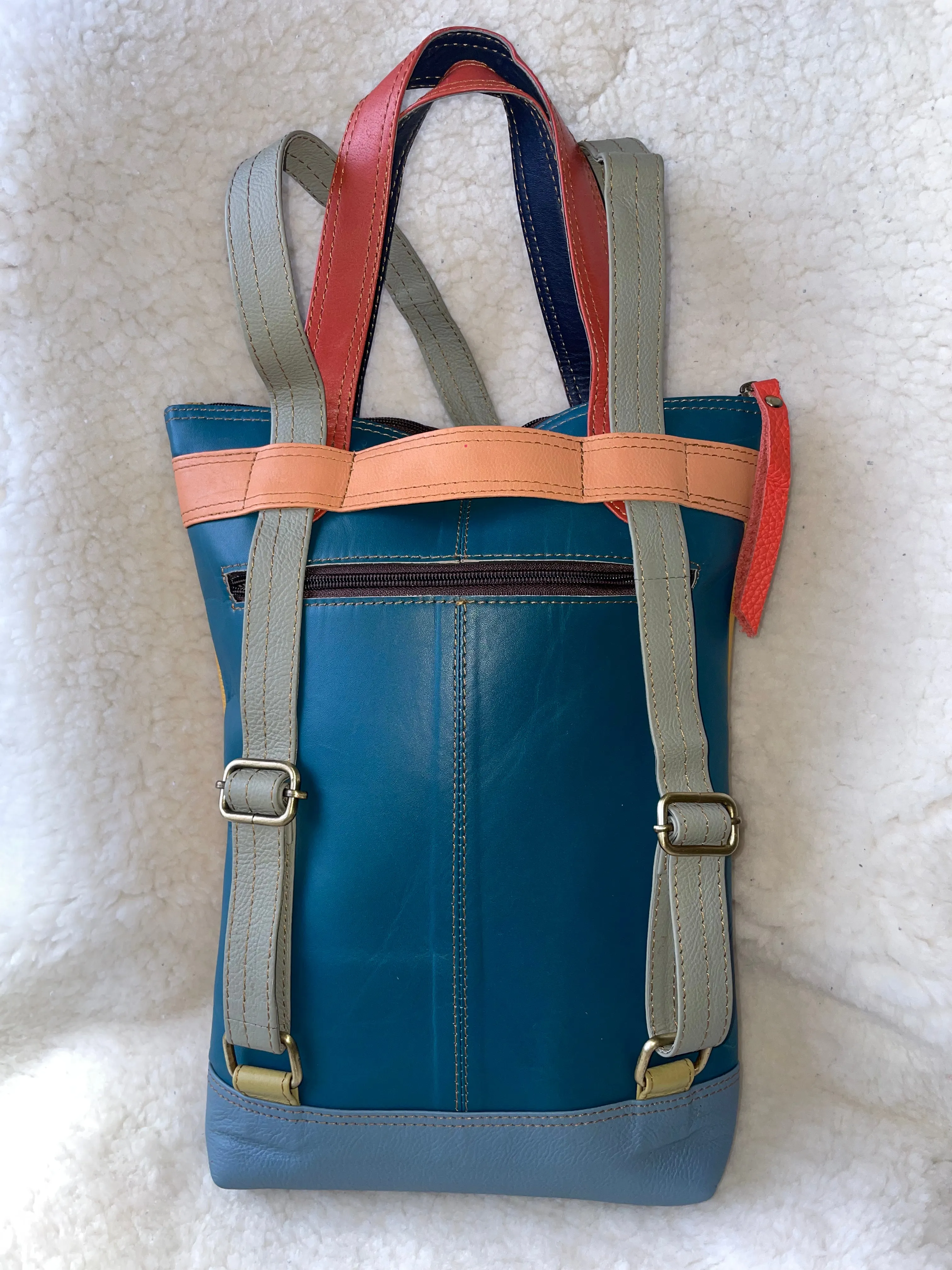 Handcrafted, Recycled Leather Backpack with Detachable Clutch.