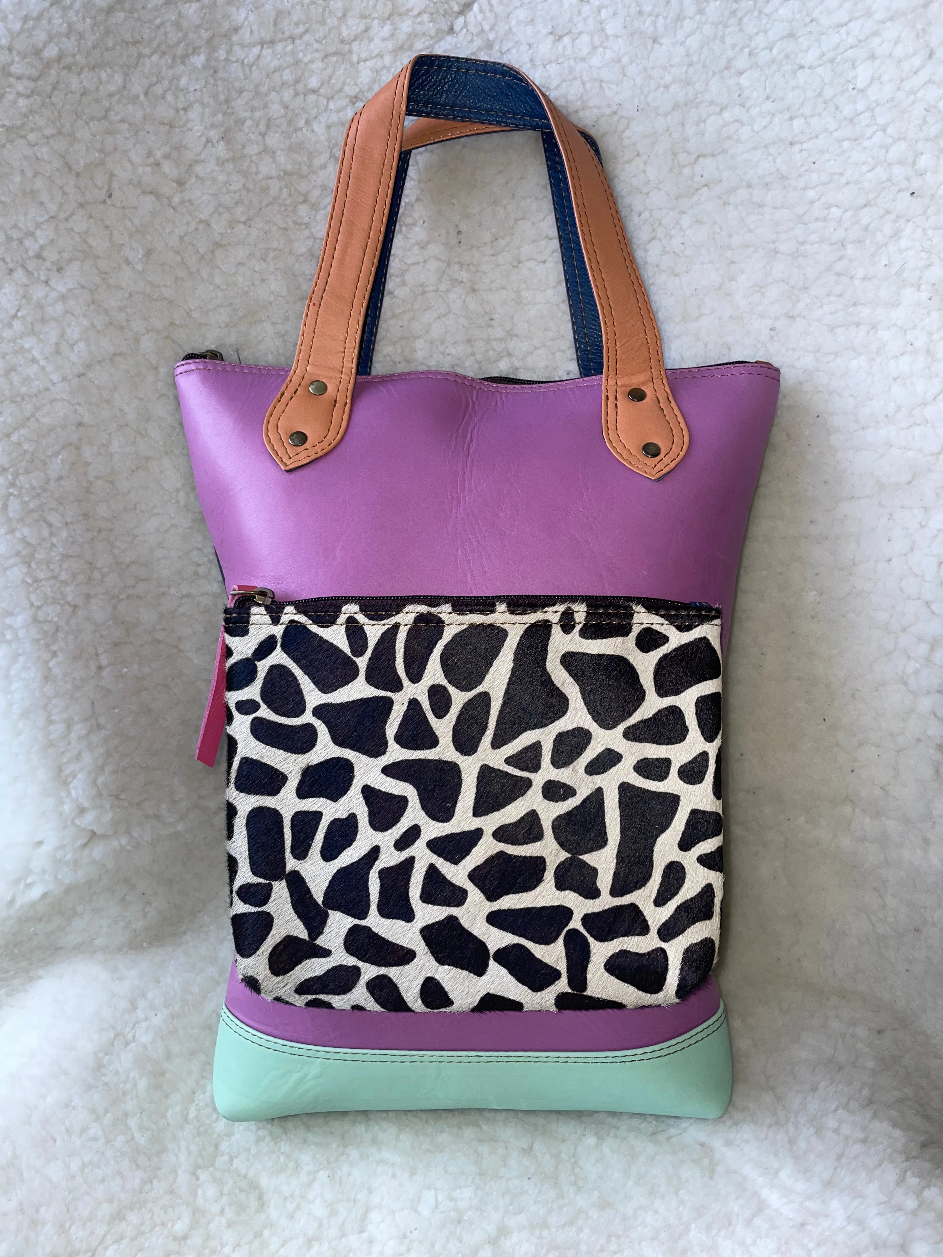 Handcrafted, Recycled Leather Backpack with Detachable Clutch.