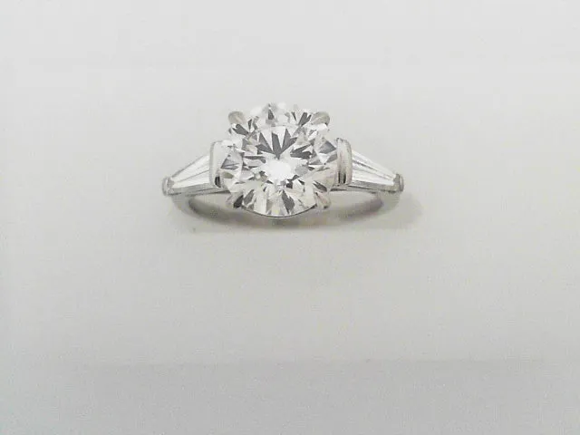 Round Brilliant Cut Diamond Ring with Tapered Baguettes