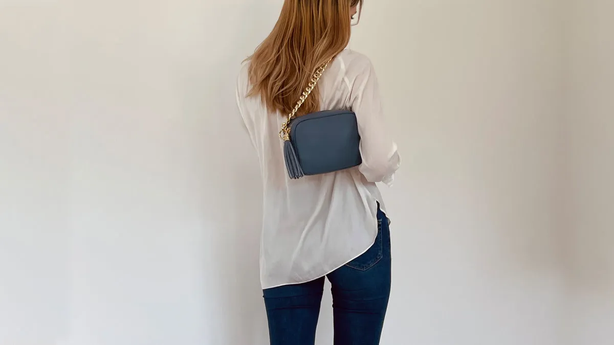 The Tassel Denim Blue Leather Crossbody Bag With Gold Chain Strap