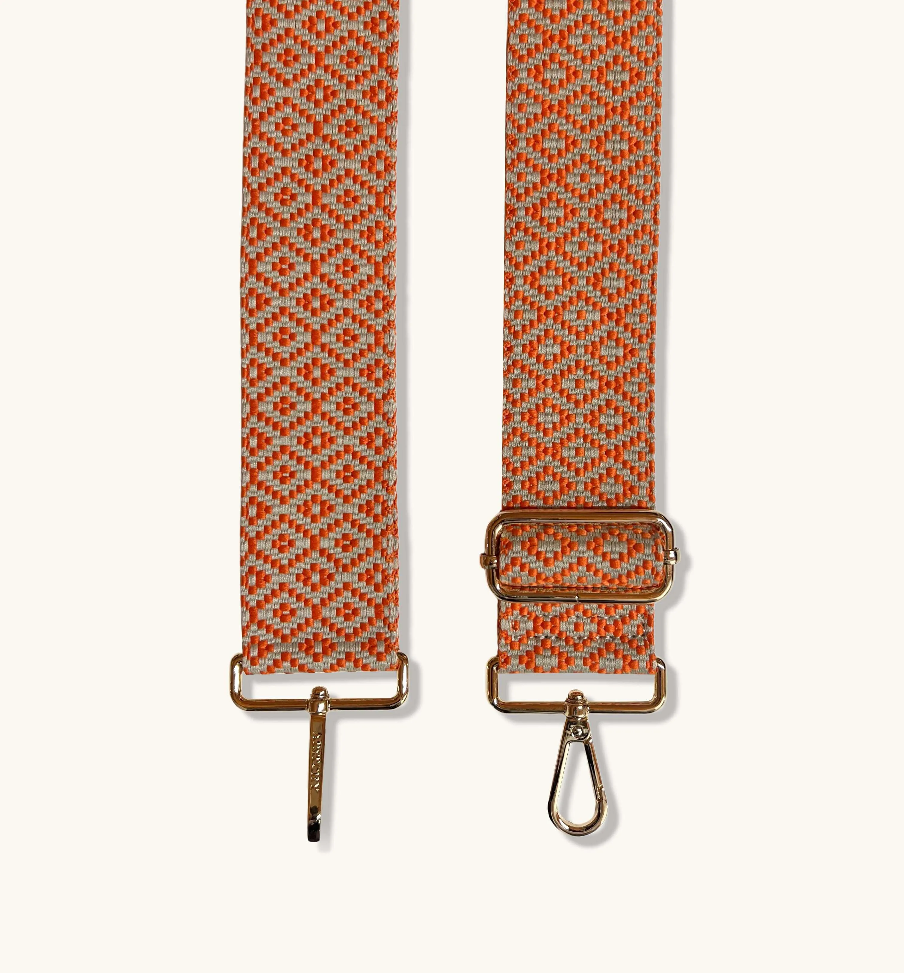 The Tassel Stone Leather Crossbody Bag With Orange Cross-Stitch Strap