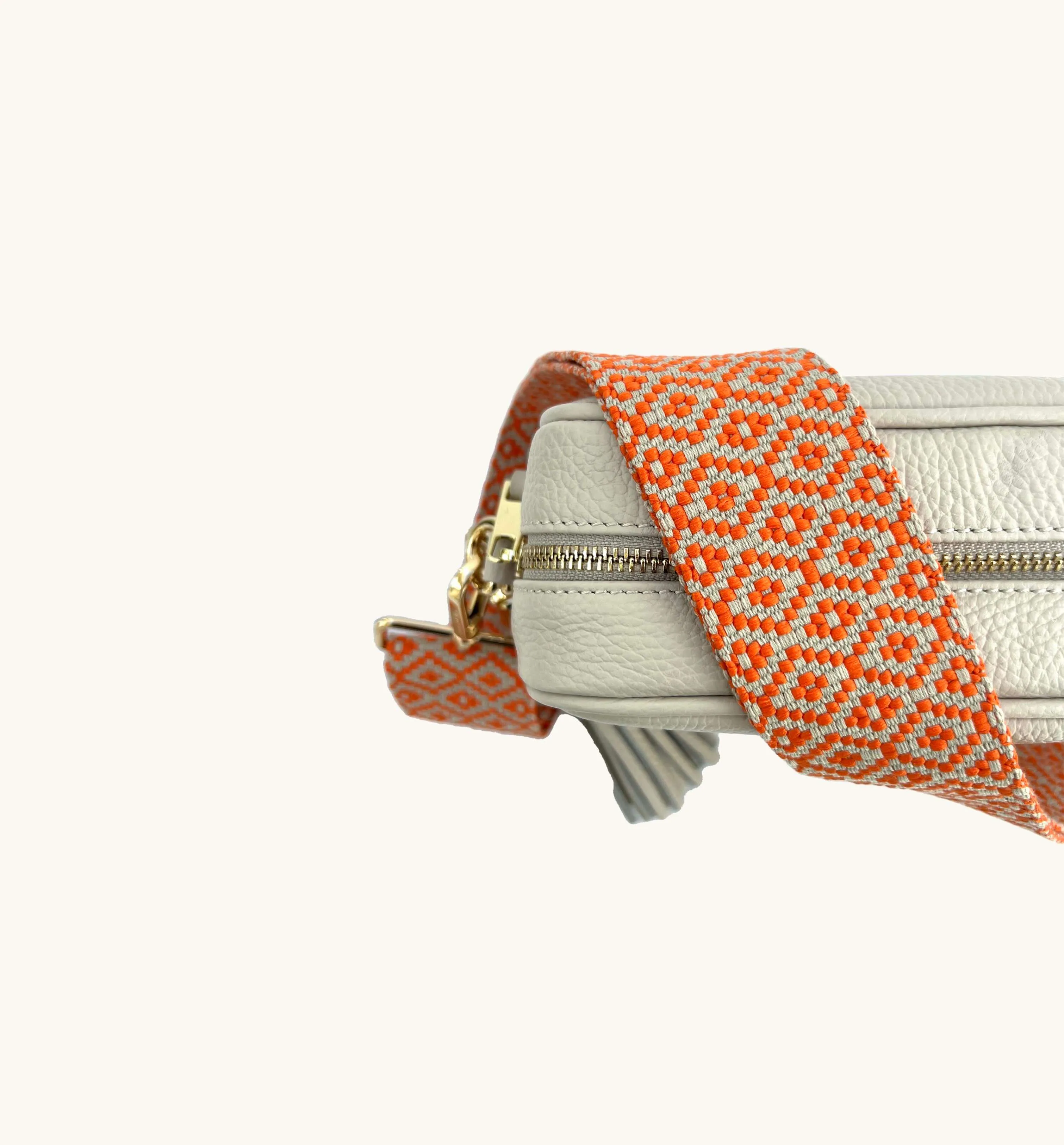 The Tassel Stone Leather Crossbody Bag With Orange Cross-Stitch Strap