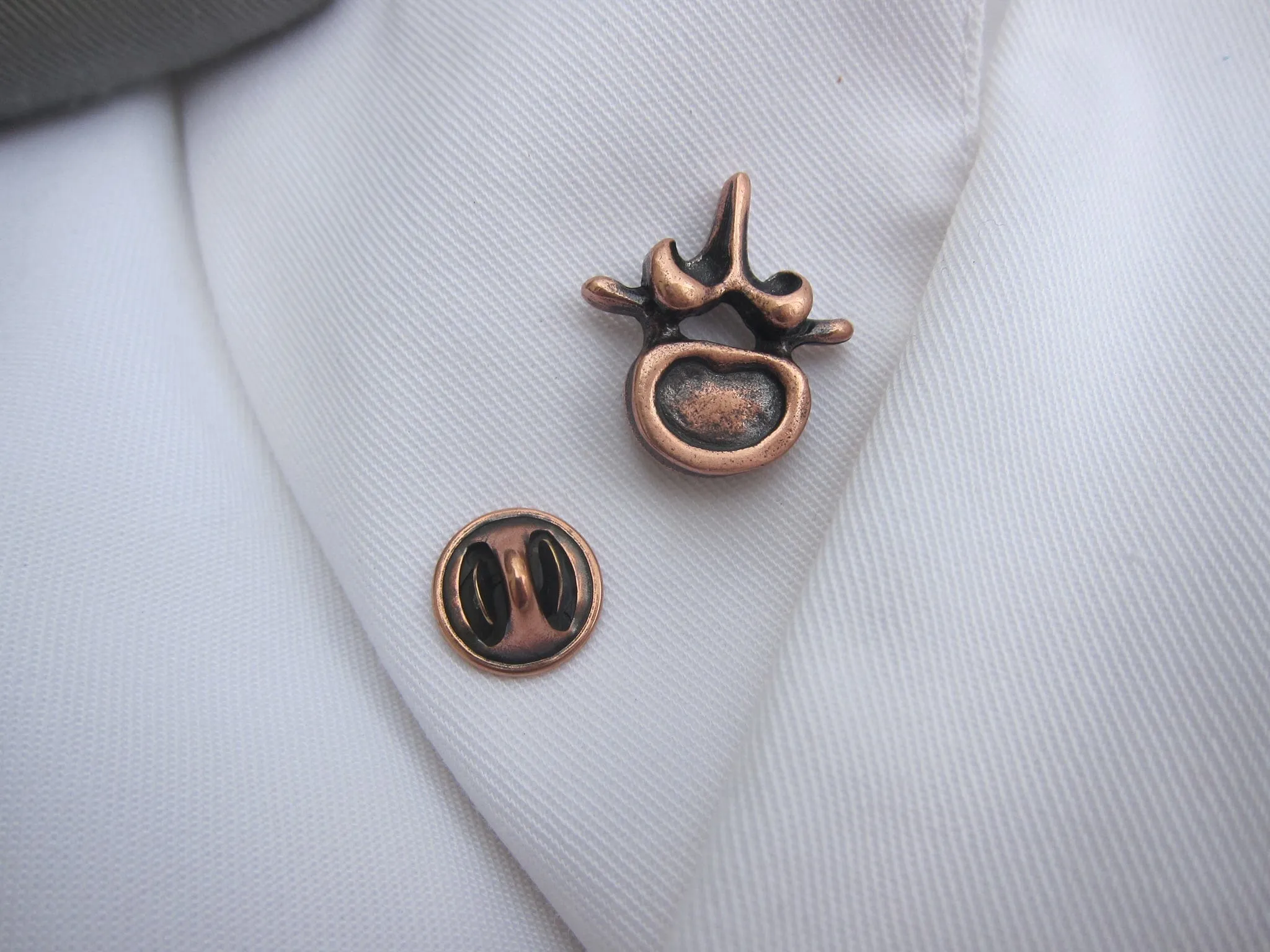 Vertebra Copper Lapel Pin
