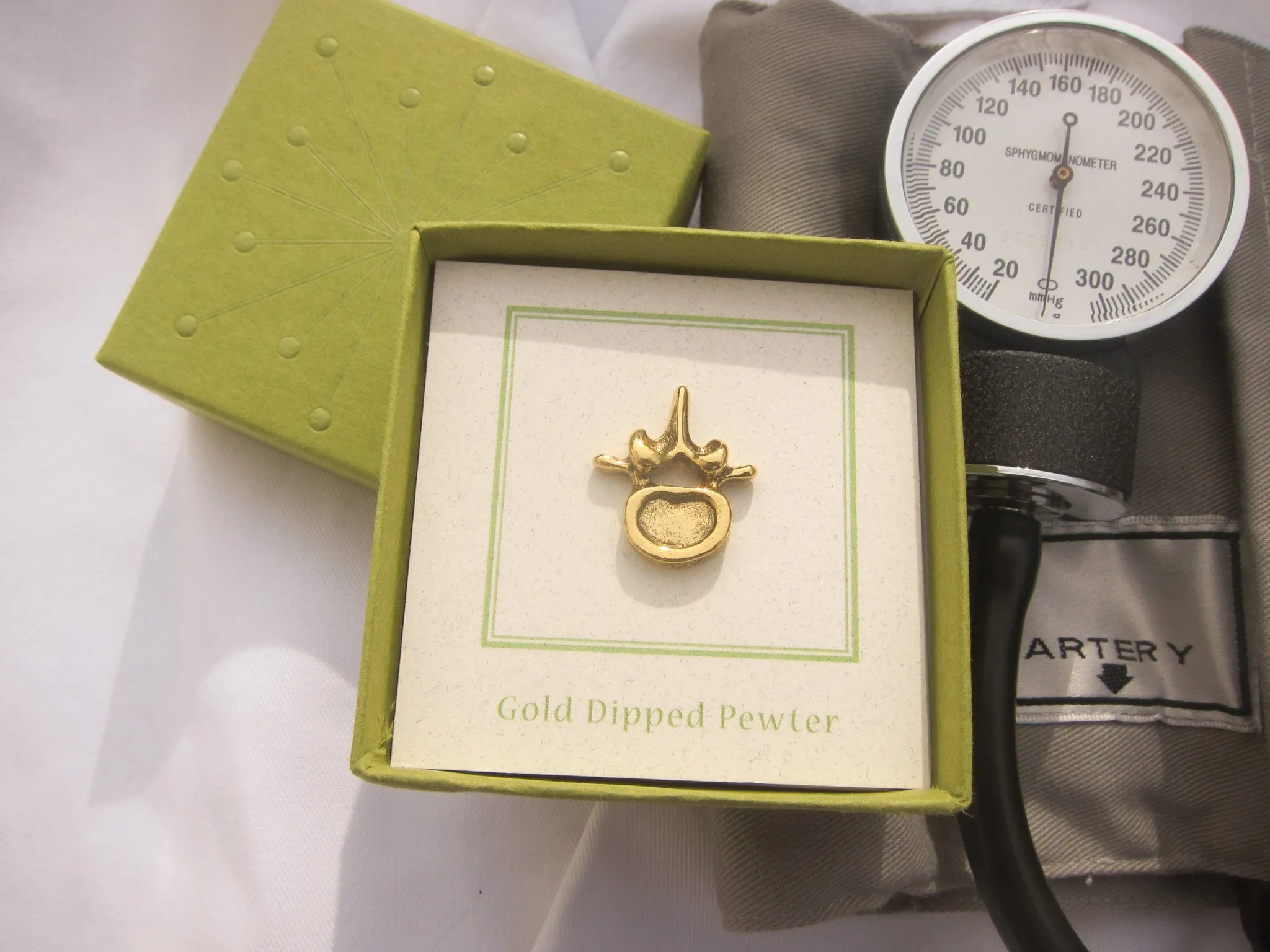 Vertebra Gold Lapel Pin