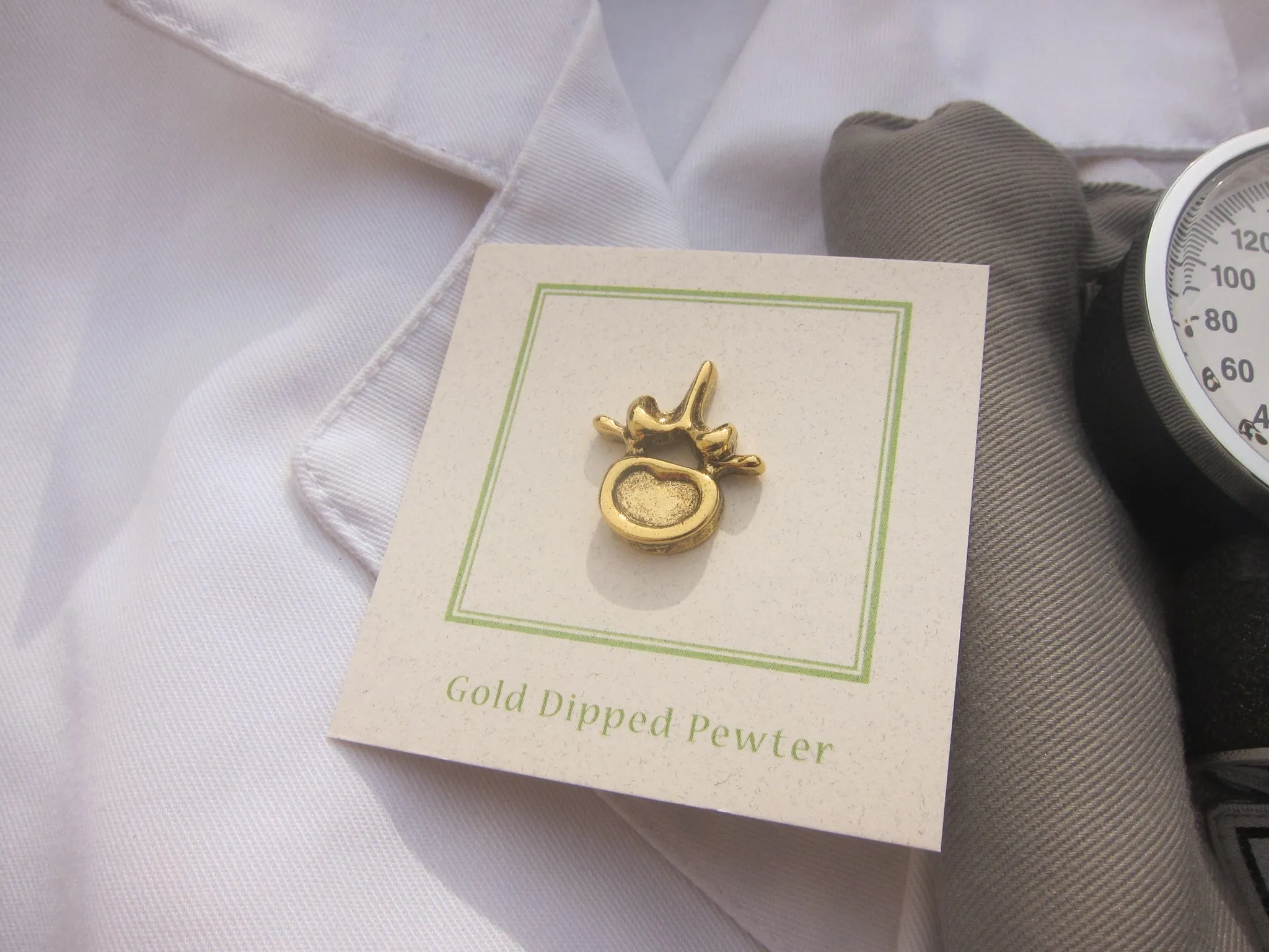 Vertebra Gold Lapel Pin